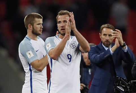 England's Harry Kane, center, and England manager Gareth Southgate, right, applaud the supporters at the end of the World Cup Group F qualifying soccer match between England and Slovenia at Wembley stadium in London. | AP File Photo