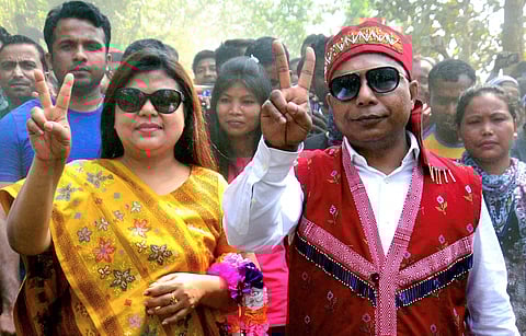 Meghalaya Chief Minister and Congress candidate Mukul Sangma along with his wife Dikkanchi D Shira flash victory sign after they won their constituencies in the Meghalaya Assembly elections at Ampati in South-West Garo Hills on Saturday. | PTI