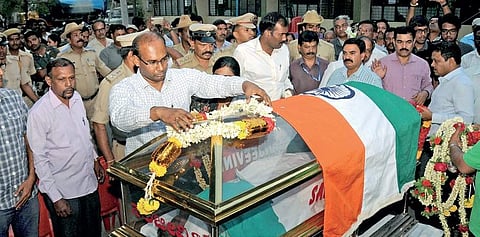 District officials paying their last respects to IFS officer S Manikandan at Aranya Bhavan in Mysuru