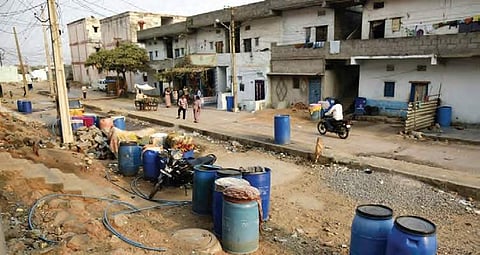 Due to water shortage problem, people storing water in drums at Ghouse Nagar colony, in Chandrayangutta | VINAY MADAPU