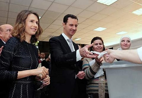 Syrian President Bashar al-Assad (C). | AFP