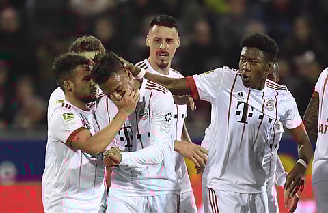 Bayern Munich players celebrate a goal during the German Bundesliga soccer match against SC Freiburg. | AP