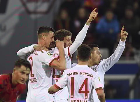Bayern Munich players celebrate a goal during the German Bundesliga soccer match against SC Freiburg. | AP