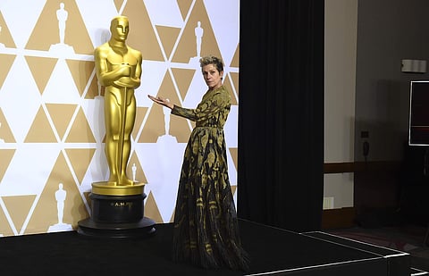 Frances McDormand, winner of the award for best performance by an actress in a leading role for 'Three Billboards Outside Ebbing, Missouri', poses in the press room at the Oscars on Sunday, March 4, 2018, at the Dolby Theatre in Los Angeles. (Photo by Jor