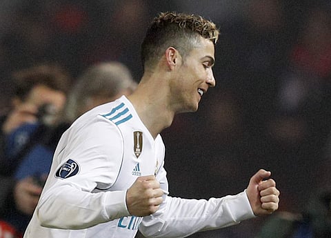 Real Madrid's Cristiano Ronaldo celebrates as he walks off the pitch after winning the Champions League round of sixteen second leg soccer match against Paris St. Germain. | Photo: AP