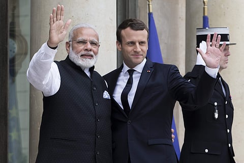 French President Emmanuel Macron, right, welcomes Indian Prime Minister Narendra Modi, before their meeting at the Elysee Palace in Paris in 2017. | AP