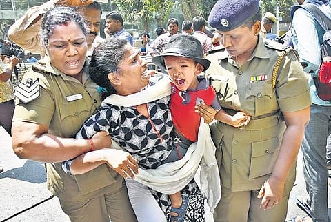 A member of Revolutionary Students Youth Federation being detained along with her child in the city on Wednesday, during a protest against the razing down of Vladimir Lenin’s statue in Tripura | ASHWIN PRASATH
