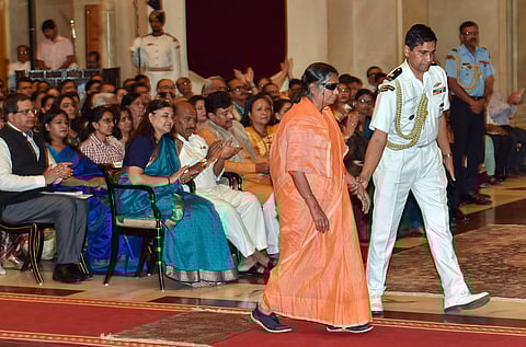 Gargi Gupta walks to receive an award from President Ram Nath Kovind for her contribution to women empowerment during Nari Shakti Puraskars 2017 function - PTI
