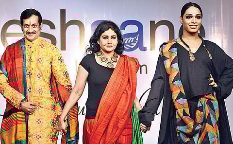 Prince Manvendra Singh of Rajpipla, Gujarat, Nina Reddy, joint marketing director, Savera Hotel, and a model on the ramp Pandarinath B