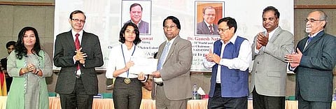 Dr G Viswanathan, founder and Chancellor, VIT, presenting the GV Special Achiever Award to Suvarna Saumya at VIT, Chennai, on Saturday | Express