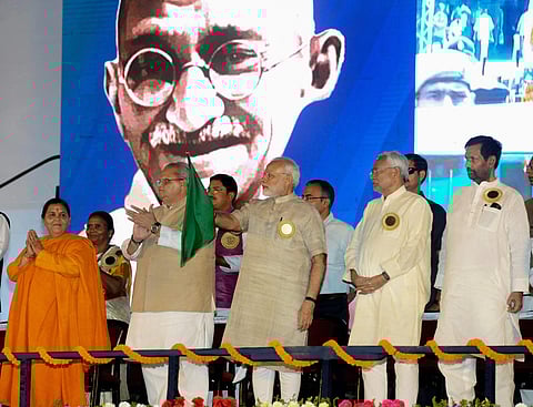 Prime Minister Narendra Modi flag off a new bi-weekly train Humsafar Express connecting Katihar to New Delhi during 'Satyagrah Se Swachhagrah' programme on the concluding ceremony of Centenary of Champaran Satyagraha celebration at Motihari in Bihar on Tu