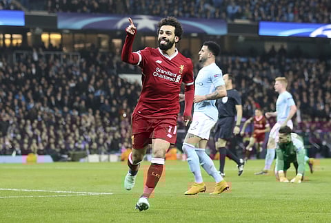 Liverpool's Mohamed Salah celebrates scoring his side's first goal of the game during the Champions League, quarterfinal second leg soccer match against Manchester City at the Etihad Stadium, Manchester, England Tuesday April 10, 2018. | AP