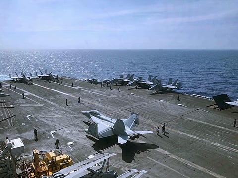 Crewmen of the U.S. aircraft carrier Theodore Roosevelt prepare their aircraft | AP
