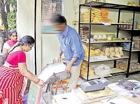 A ration shop dealer selling food items to customers in Hyderabad | sathya keerthi