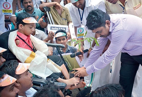 Muhammed Aasim protests in front of the Civil Station demanding the upgradation of Vellimanna UP School | Manu R Mavelil