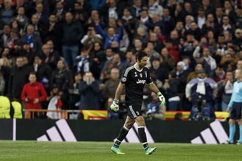 Juventus goalkeeper Gianluigi Buffon leaves the game after receiving a red card, during a Champions League quarter final second leg soccer match between Real Madrid and Juventus at the Santiago Bernabeu stadium. | AP