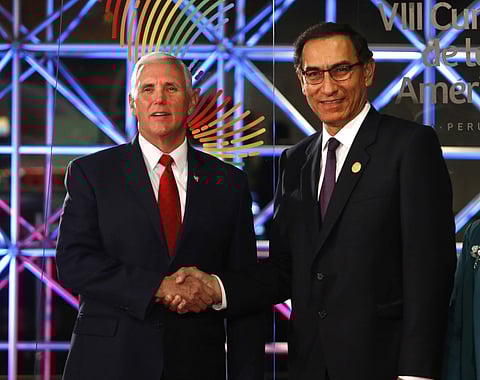 U.S. Vice President Mike Pence, left, shakes hands with Peru's President Martin Vizcarra, before the Summit of Americas inauguration ceremony, in Lima, Peru, Friday, April 13, 2018. | AP