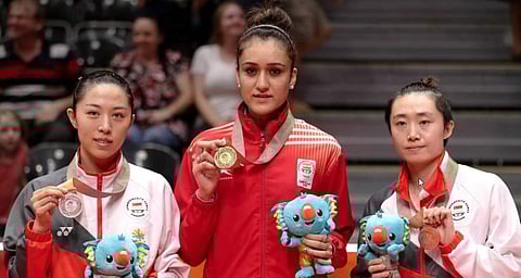 Table Tennis - Gold Coast 2018 Commonwealth Games - Women's Singles Medal Ceremony - Oxenford Studios - Gold Coast, Australia - April 14, 2018 - Silver medalist Mengyu Yu of Singapore, gold medalist Manika Batra of India and bronze medalist Tianwei Feng o