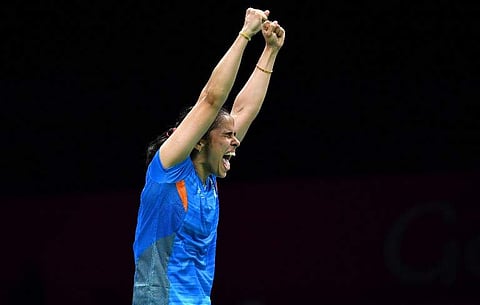 Saina Nehwal celebrates her victory over her India's Venkata Pusarla in their badminton women's single final match at the 2018 Gold Coast Commonwealth Games in Gold Coast on April 15, 2018. Saeed KHAN / AFP