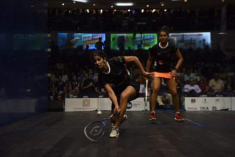 India's Joshana Chinnappa (L) plays a shot against her compatriot Dipika Pallikal during the women's final match at the 19th Asian Squash Championship in Chennai on April 30, 2017. ARUN SANKAR / AFP