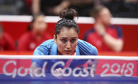 India's Manika Batra prepares to return serve while playing Charlotte Carey of Wales during their women's team match the 2018 Commonwealth Games at the Oxenford Studios on the Gold Coast, Australia, Thursday, April 5, 2018. (AP Photo/Rick Rycroft)