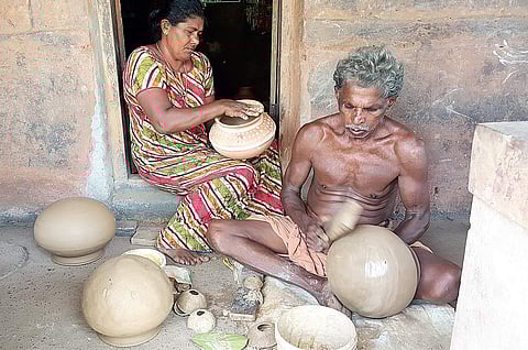 T M Kumaran making rice pots, and wife Draupadi decking them up to be sold for Vishu at Erikulam in Madikai panchayat in Kasargod