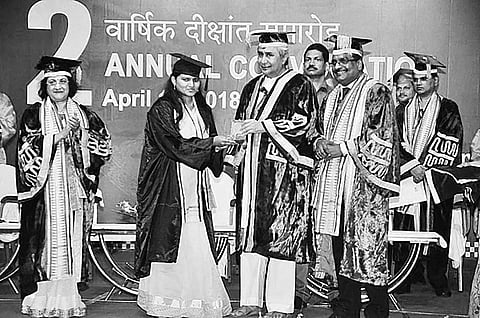 A student receives gold medal from Chief Minister Naveen Patnaik at Sambalpur on Sunday | Express