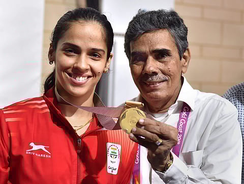 Women's singles badminton gold medalist Saina Nehwal with her father during the Commonwealth Games 2018 in Gold Coast. (PTI)