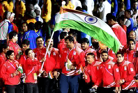 Flagbearer MC Mary Kom leads the Indian contingent during the closing ceremony of Commonwealth Games. (PTI)
