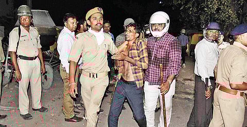 Police arrest miscreants after a clash between Rajput and Dalit community members, in Ahmedabad on Tuesday | PTI