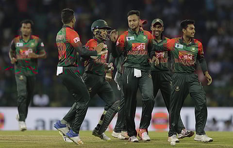 Bangladesh's Shakib Al Hasan, center, celebrates the the dismissal of Sri Lanka's Danushka Gunathilaka. | File AP