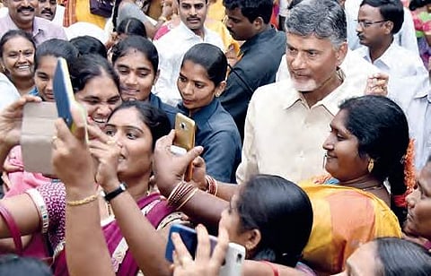 Women take selfies with CM N Chandrababu Naidu after he launched the Chandranna Pelli Kanuka programme at CM's residence in Undavalli on Wednesday | EXPRESS