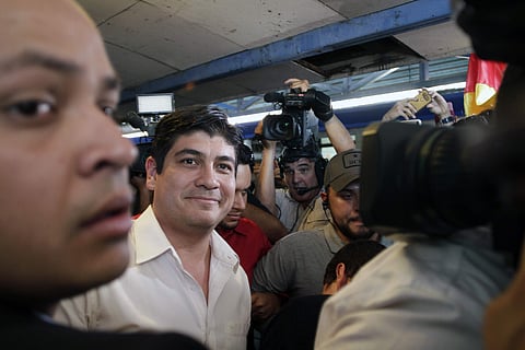 Presidential candidate Carlos Alvarado, with Citizen Action Party, walks away after casting his vote in a presidential runoff election in San Jose, Costa Rica, Sunday, April 1, 2018. | Associated Press
