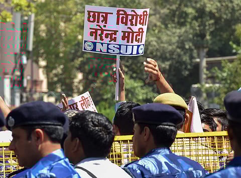 NSUI activists and 10th and 12th CBSE class students raise slogans against Union HRD Minister Prakash Javedkar regarding the alleged CBSE paper leak in New Delhi. | File PTI