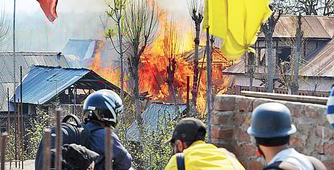 Flames leap from a house that was damaged during the encounter in Kanchidora, Kashmir (Express Photo | Zahoor Punjabi)