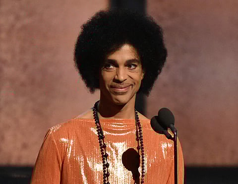 his Feb. 8, 2015, file photo shows Prince presenting the award for album of the year at the 57th annual Grammy Awards in Los Angeles. (Photo: AP)