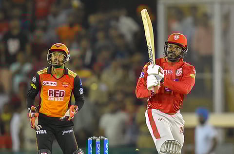 Kings XI Punjab batsman Chris Gayle plays a shot during IPL T20 cricket match against Sunrisers Hyderabad in Mohali on Thursday. (PTI)