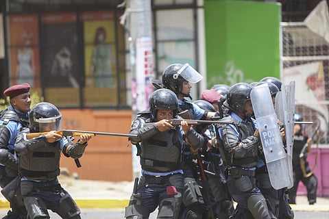 Riot police charge demonstrators during clashes in Managua, Nicaragua | AP