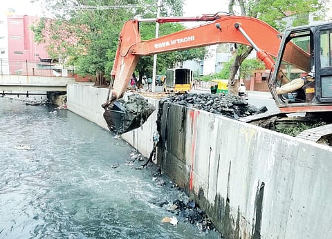 Accumulated debris and other waste being cleared from a storm water drain near Maharaja Junction in Koramangala valley | EXPRESS