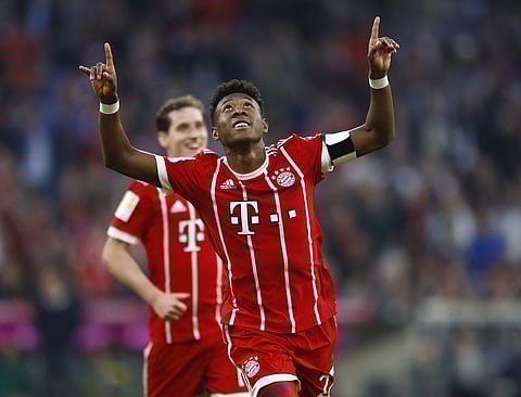 Bayern's David Alaba celebrates after scoring his side's fourth goal during the German Bundesliga soccer match between FC Bayern Munich and Borussia Moenchengladbach in Munich, Germany, Saturday, April 14, 2018. | AP