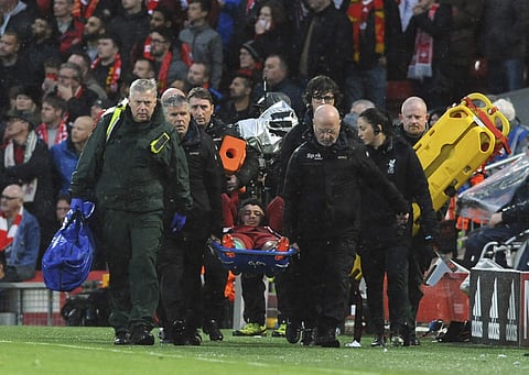 Liverpool's Alex Oxlade-Chamberlain is carried on a stretcher after getting injured during the Champions League semifinal, first leg, soccer match between Liverpool and AS Roma at Anfield Stadium, Liverpool, England, Tuesday, April 24, 2018. | AP