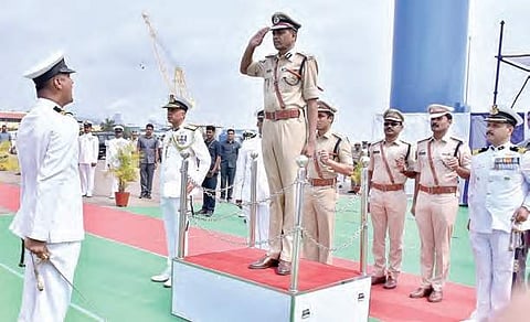 DGP M Malakondaiah takes salute at the boat commissioning ceremony at the Kakinada deep water port on Wednesday | Express