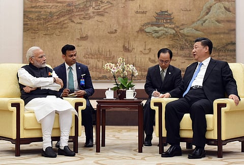 Indian Prime Minister Narendra Modi, left, meets with Chinese President Xi Jinping in Wuhan, China (File Photo | AP)