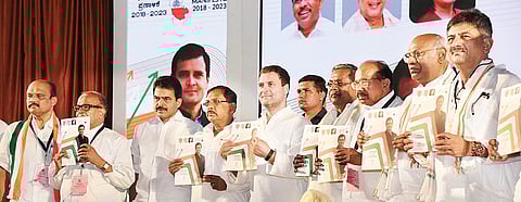Congress president Rahul Gandhi releasing the party’s election manifesto in Mangaluru on Friday. Chief Minister Siddaramaiah, former CM Veerappa Moily, KPCC chief G Parameshwara, MP Mallikarjun Kharge, Energy Minister D K Shivakumar, party veteran Janardh