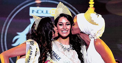 Estefania Garcia of Mexico, the winner of Indulge Miss Glam World, being congratulated by Fahima Kulow from Kenya, the first runner-up, and Aileena Catherin, of India, second runner-up | Albin mathew