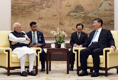 In this photo released by the Indian Ministry of External Affairs, Indian Prime Minister Narendra Modi, left, meets with Chinese President Xi Jinping in Wuhan, China, Friday, April 27, 2018. | AP