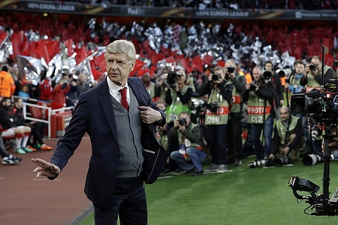 Arsenal's manager Arsene Wenger arrives at the pitch before the Europa League semifinal first leg soccer match between Arsenal FC and Atletico Madrid at Emirates Stadium in London, Thursday, April 26, 2018. | AP