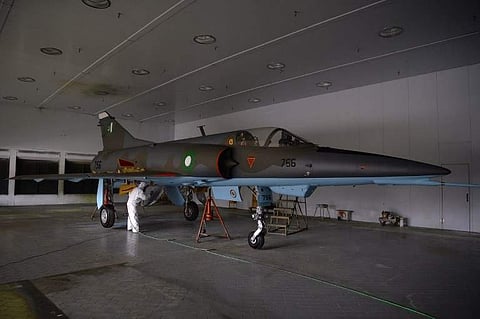 In this picture taken on December 27, 2017, technicians paint a Mirage aircraft after being serviced by the Pakistan Air Force (PAF) at the Mirage Rebuild Factory (MRF) in Kamra, west of the capital Islamabad. | AFP