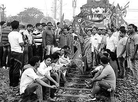 Agitators protest on tracks at Sambalpur Railway Station and closed business establishments in Rourkela on Monday | EXPRESS