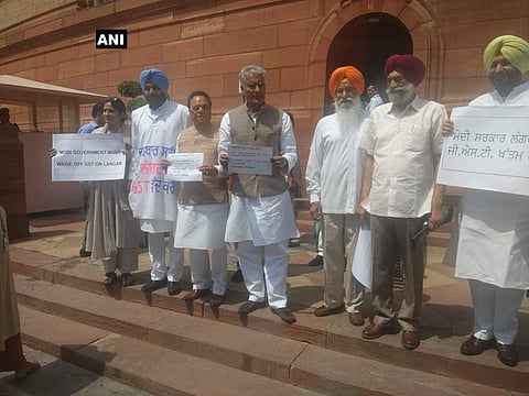 Congress MPs from Punjab, protest in Parliament premises, demand removal of GST from food items purchased for 'langar' (Photo: ANI)